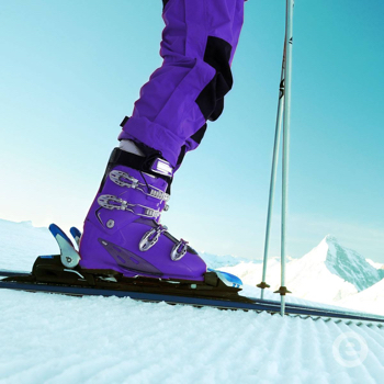 photo of purple ski boots on the snow