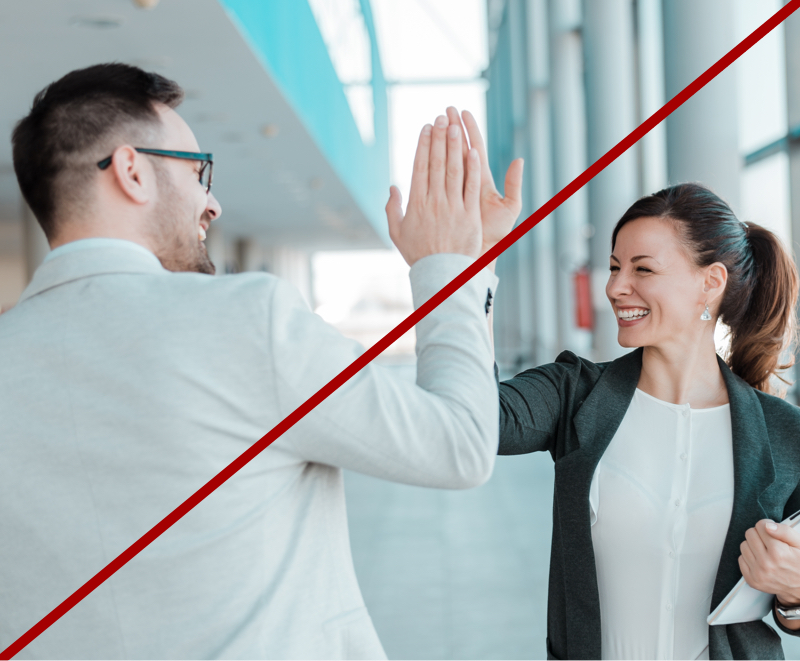 photo of man and woman giving high five